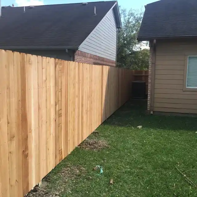 New cedar privacy fence along a side yard corner